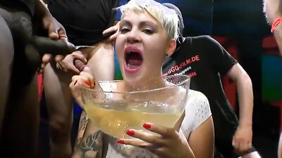 Kinky blonde girl drinks a lot of piss in this golden shower party